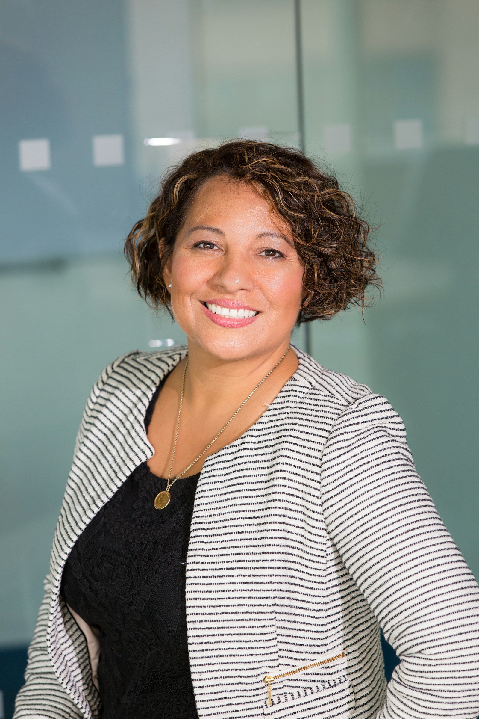 Professional life coach with a warm, confident presence
